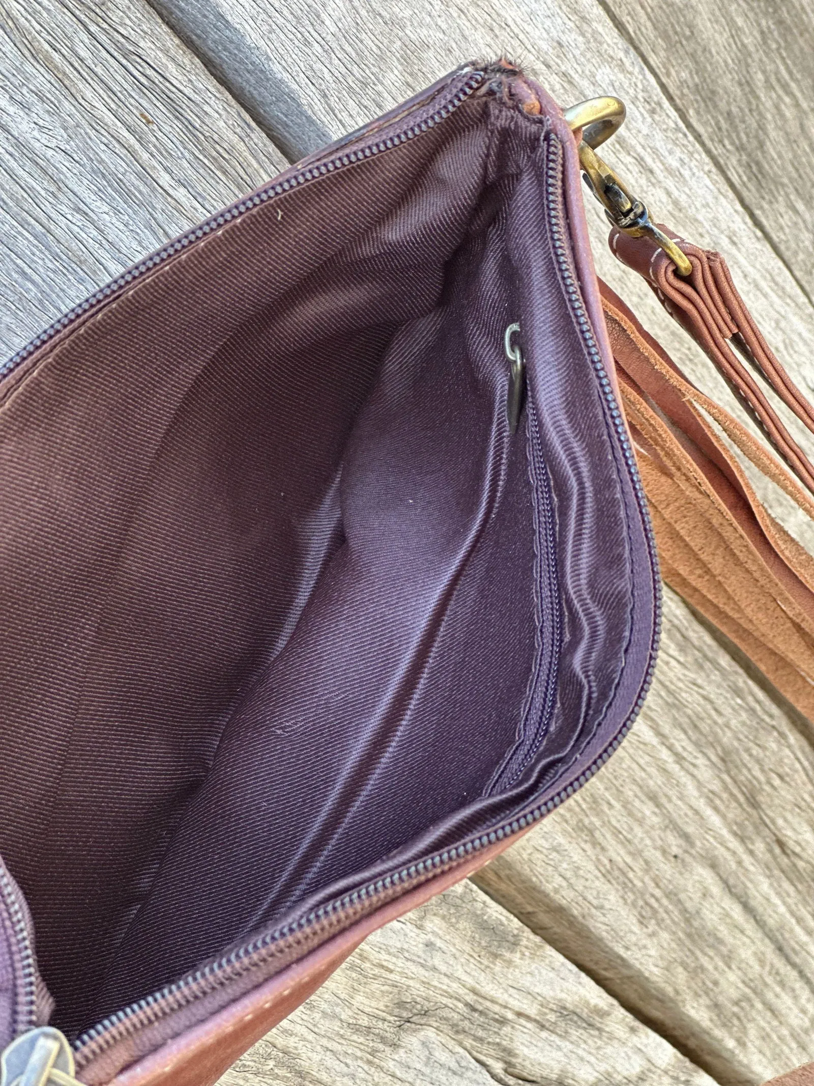 Homer & Hide Cowhide Clutch with Tassels & Tooling Details