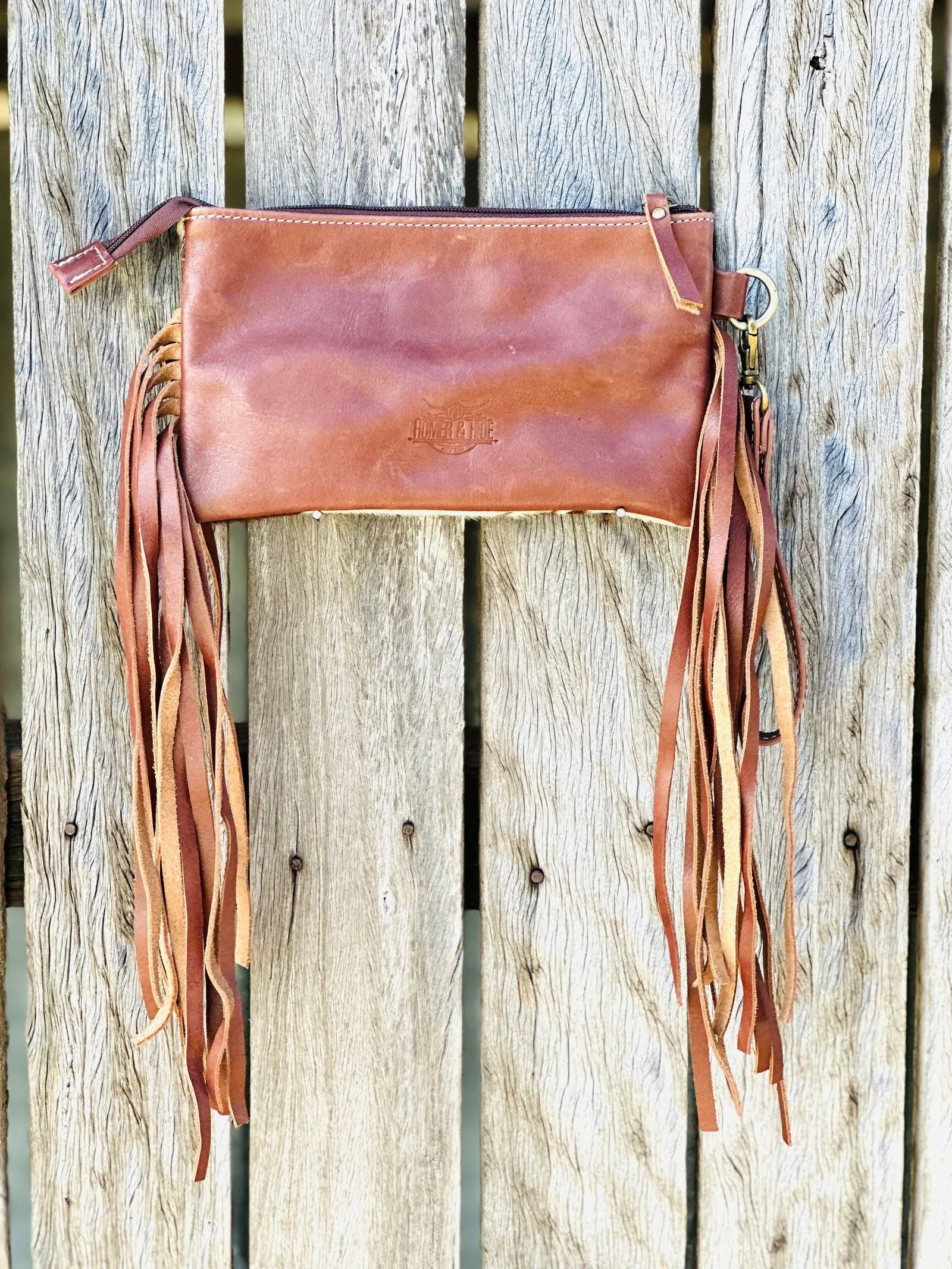 Homer & Hide Cowhide Clutch with Tassels & Tooling Details